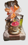Ring the cancer-free bell gift set with a gold teacup and rose, wrapped with a peach and pink bow